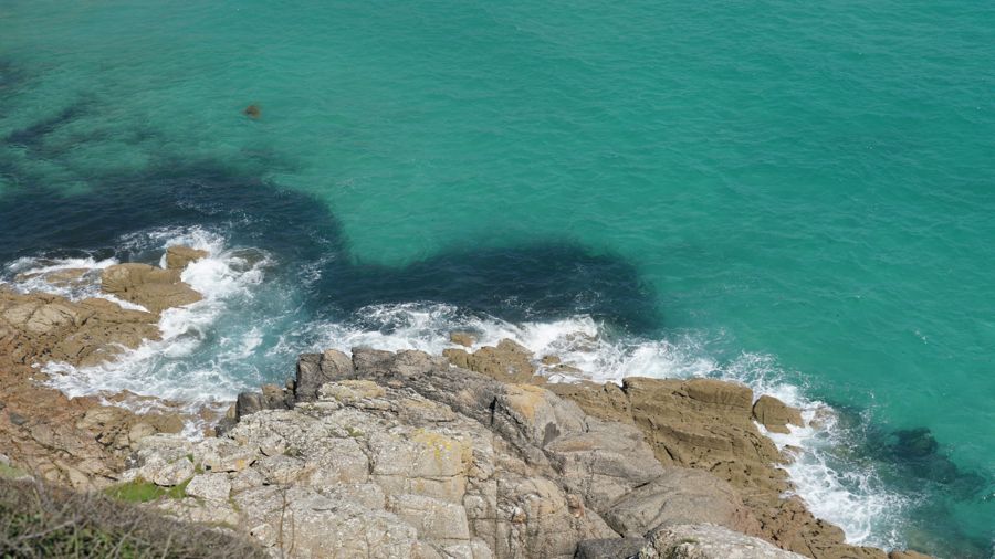 Turquoise sea and granite rocks on the Cornish coast
